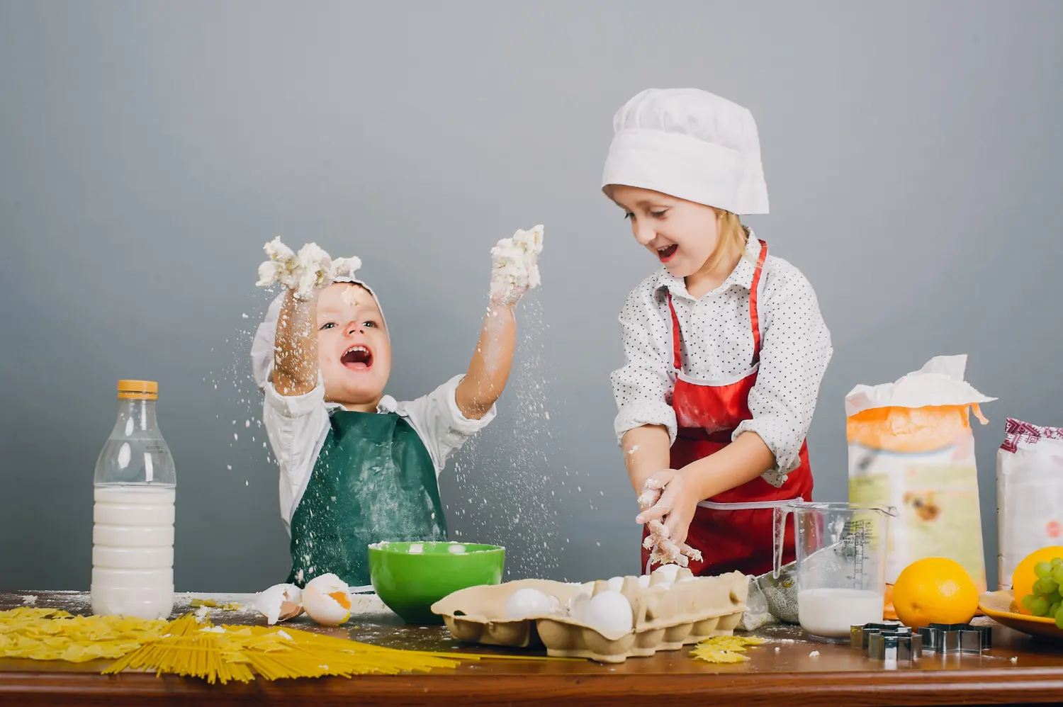 Two kids enjoying in the kitchen- cream cheese recipes