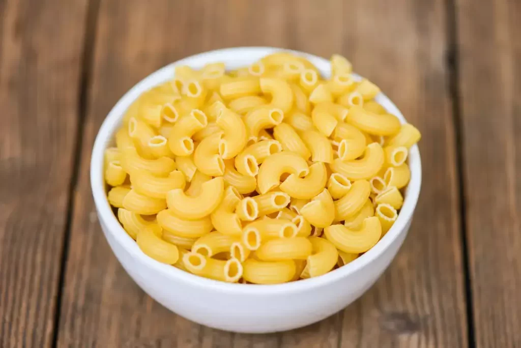 raw macaroni in a bowl - cream cheese pasta recipe